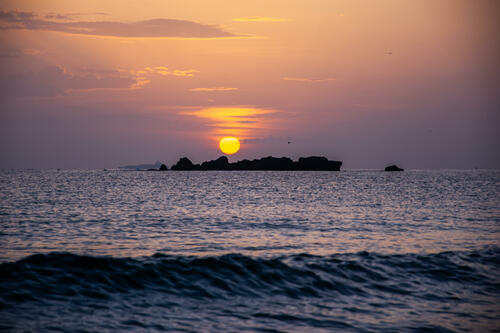 Sunrise behind rocks